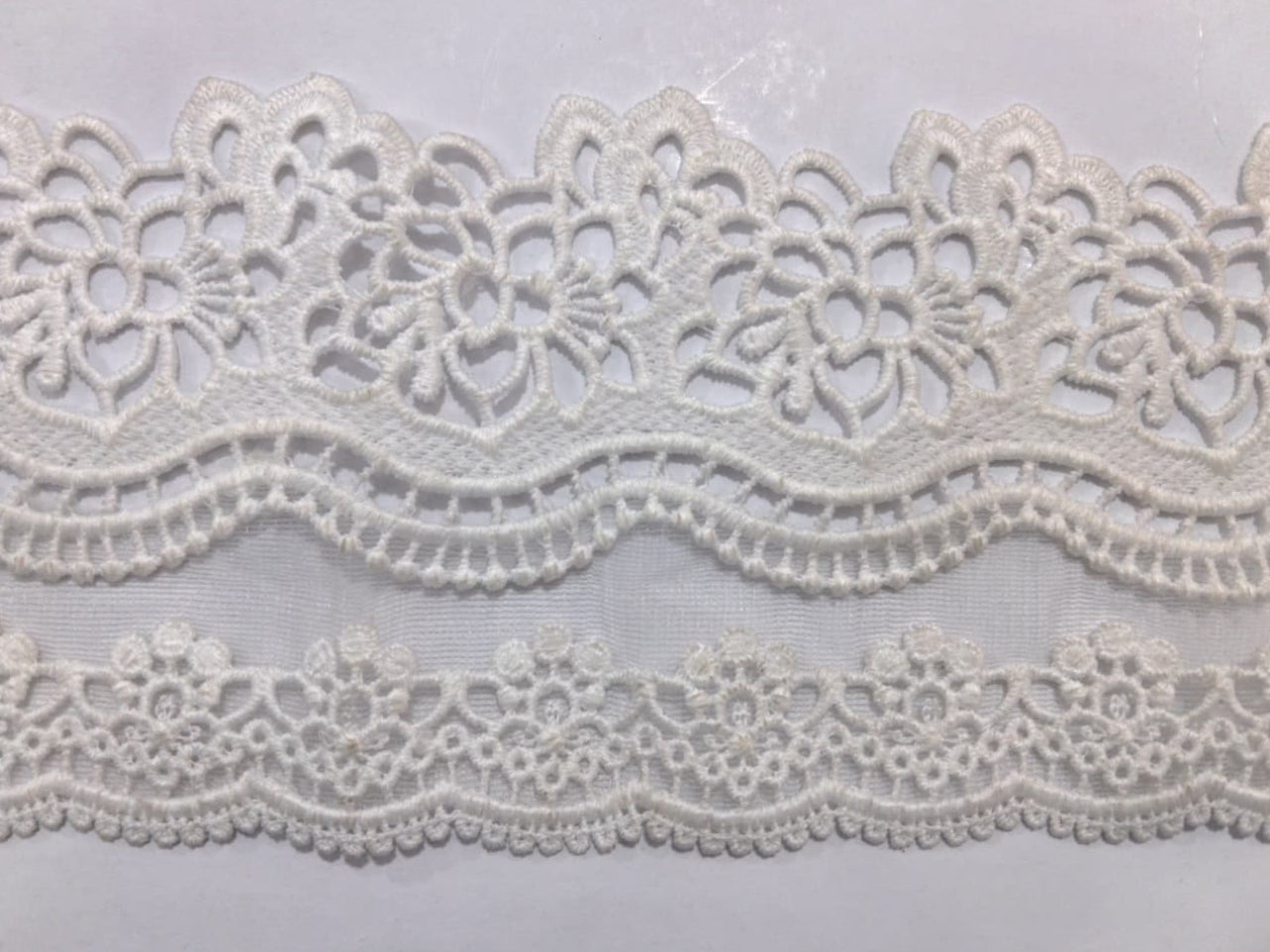 3D Milky White Lace.Lace size is approximately 3.75-4Inch. The Lace is available as per yard.