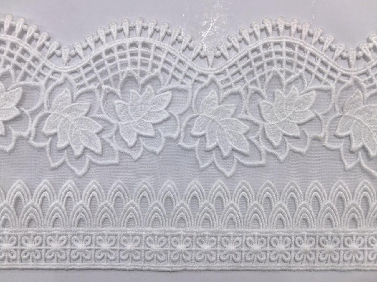 3D Milky White Lace. Lace size is approximately 4.25-4.95 inches. Lace is available as per yard.
