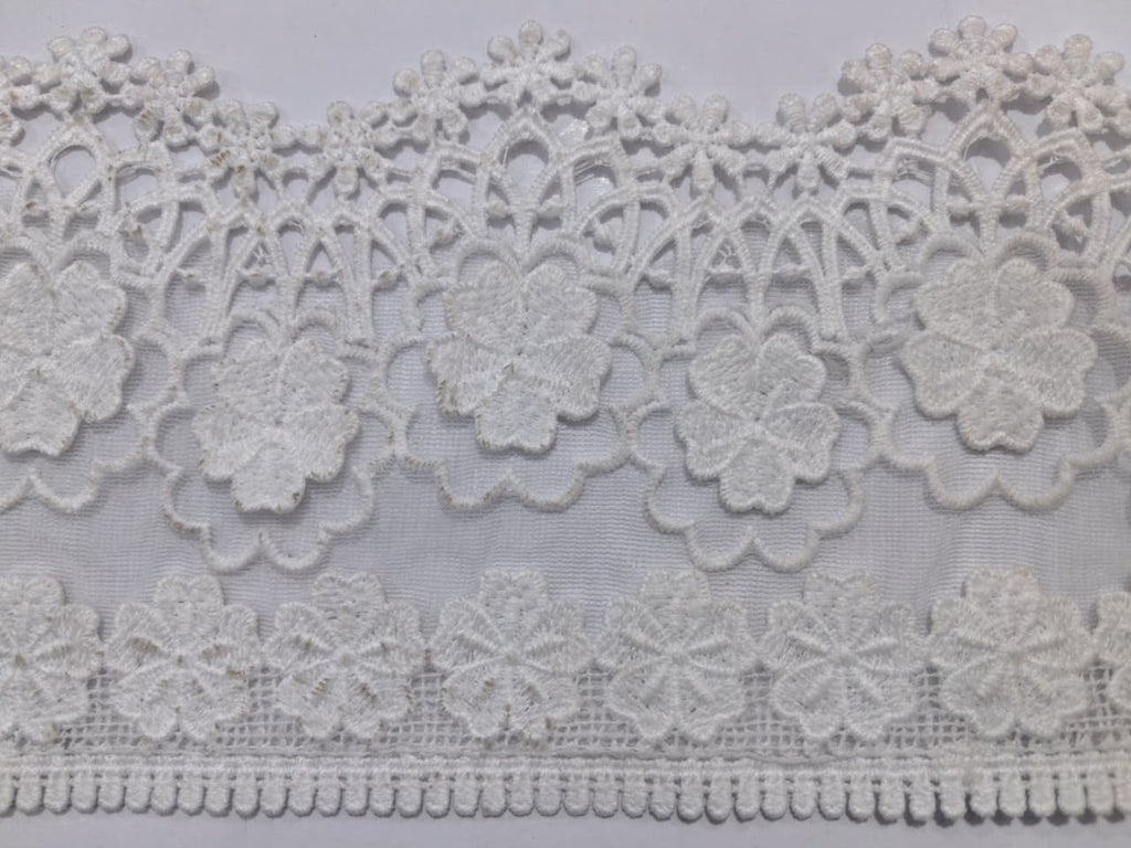 3D Milky White Lace. Lace size is approximately 4.85-5 inches. Lace is available as per yard