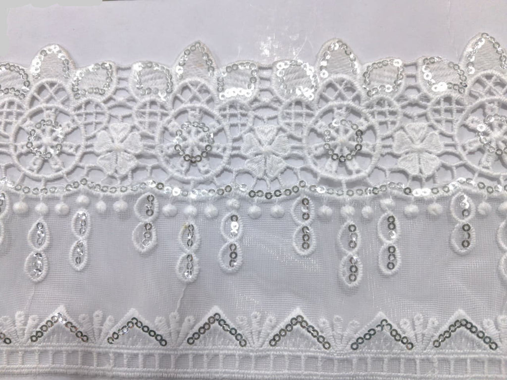 3D Fancy Sequence Milky White Lace. Lace sixe is approximately 4.25-4.5 inches. Lace is available as per yard.
