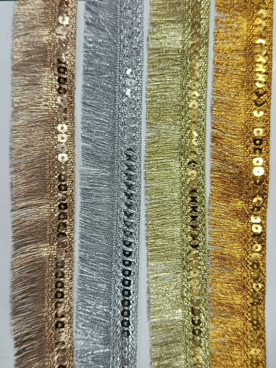 Frill Premium Metallic Sequin Fringe Lace. Available in 4 colours. Lace is available as per yard.