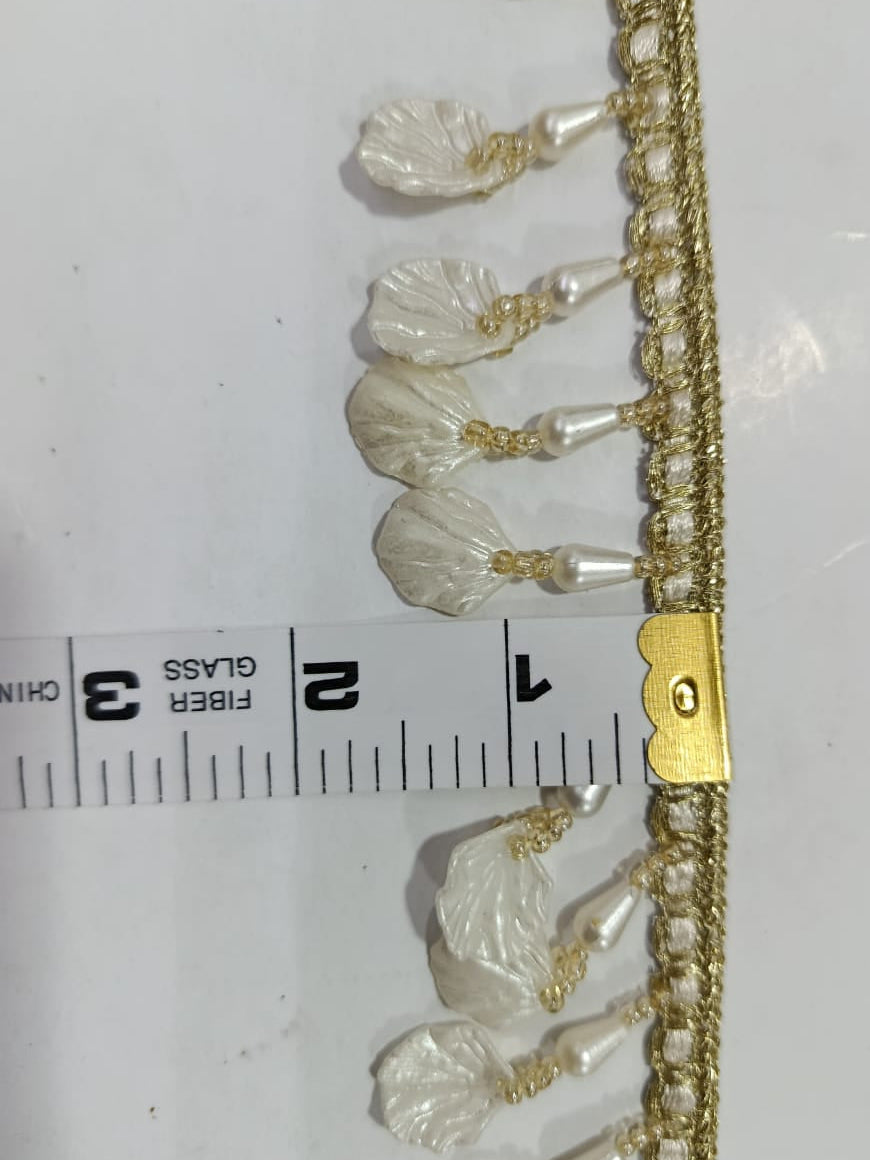 Elegant Pearl Drop Shell Fancy Lace. Lace size is approximately 1.15-1.25 Inches. Lace is available as per yard.