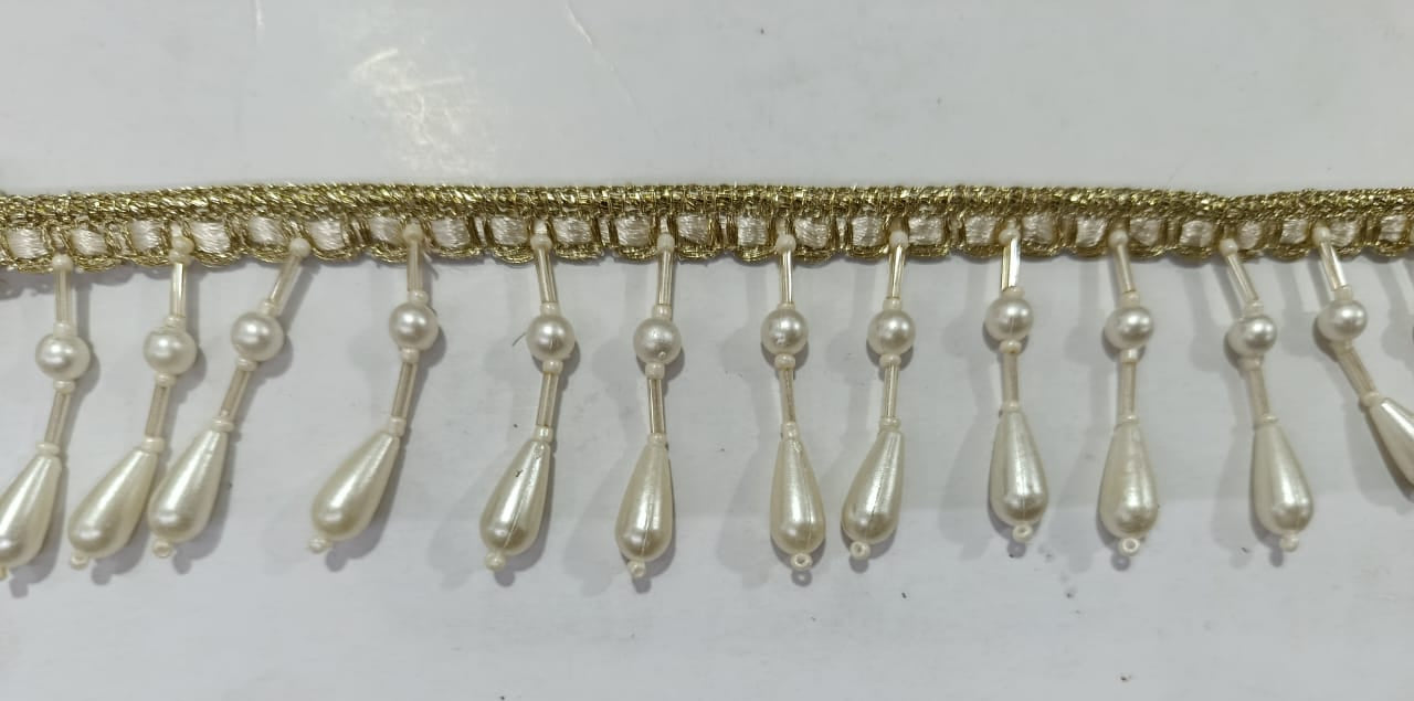 Elegant Pearl Drop Lace. Lace size is approximatel 1.5 Inches. Lace is available as per yard.