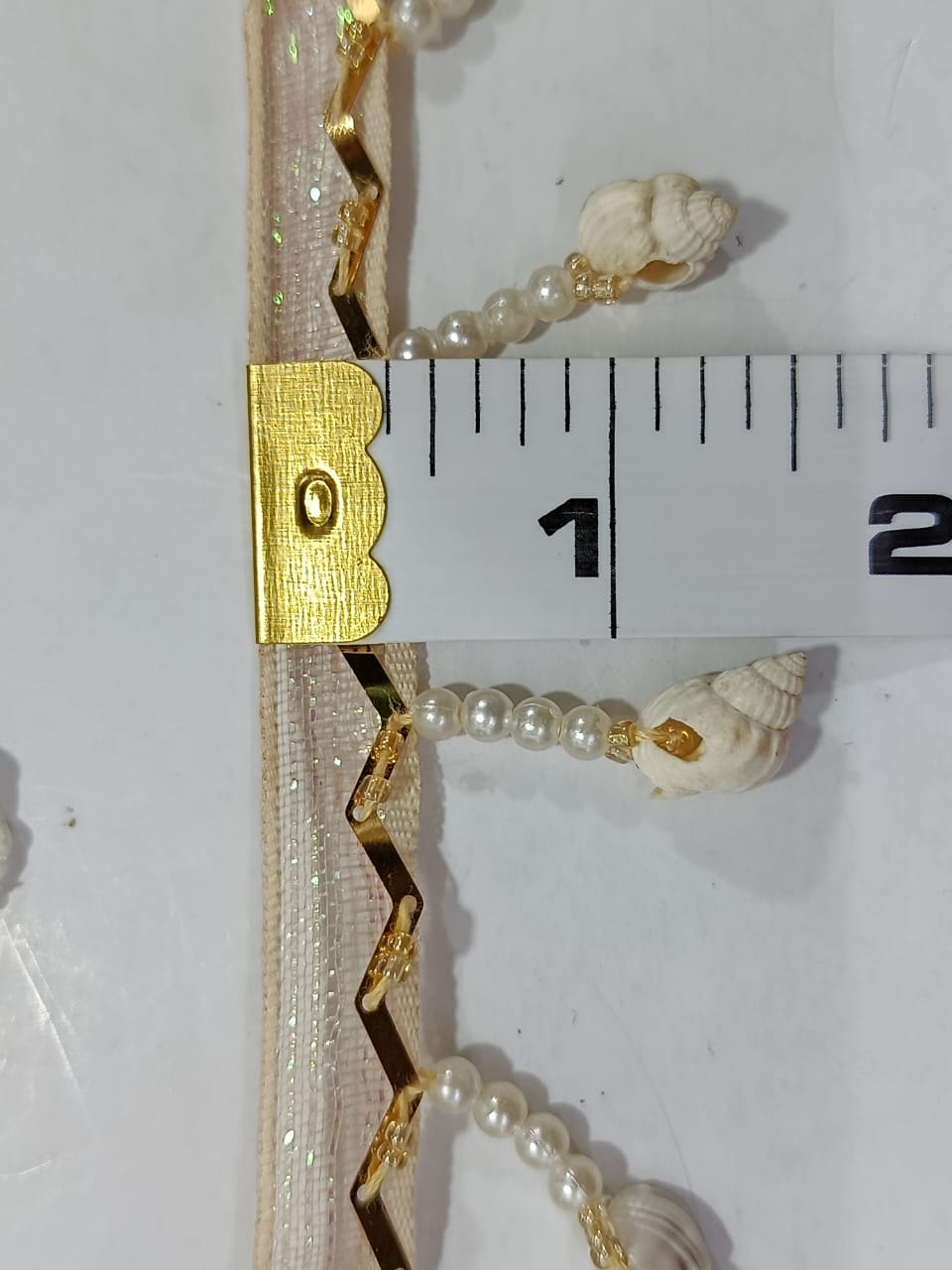 Elegant Pearl & Shell Decorative Lace. Lace Size is approximately 1.25-1.45 Inches. Lace is available as per yard.