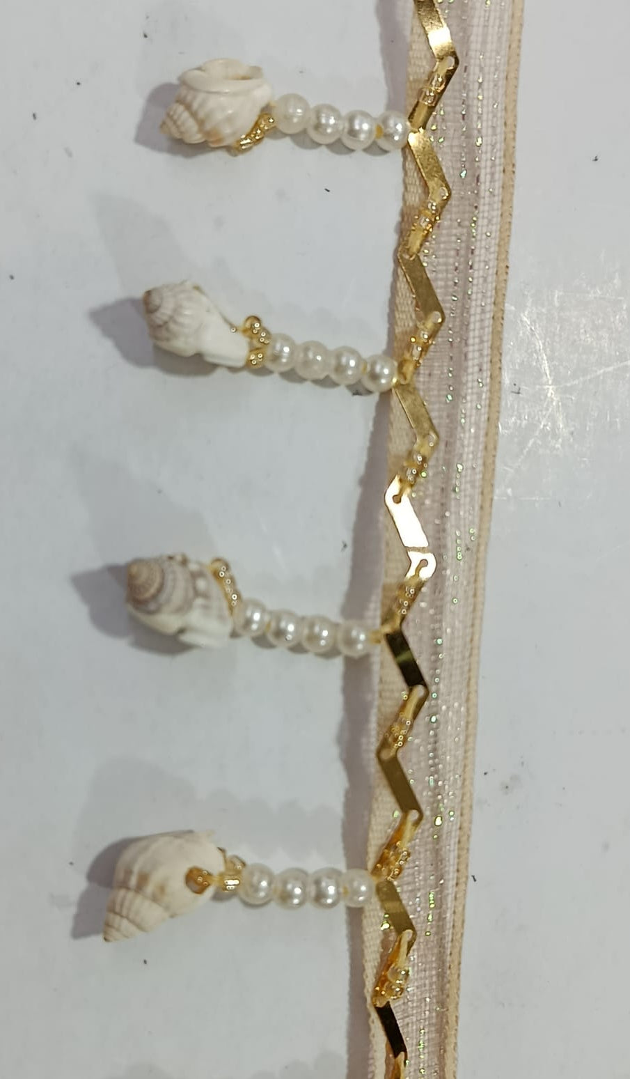 Elegant Pearl & Shell Decorative Lace. Lace Size is approximately 1.25-1.45 Inches. Lace is available as per yard.