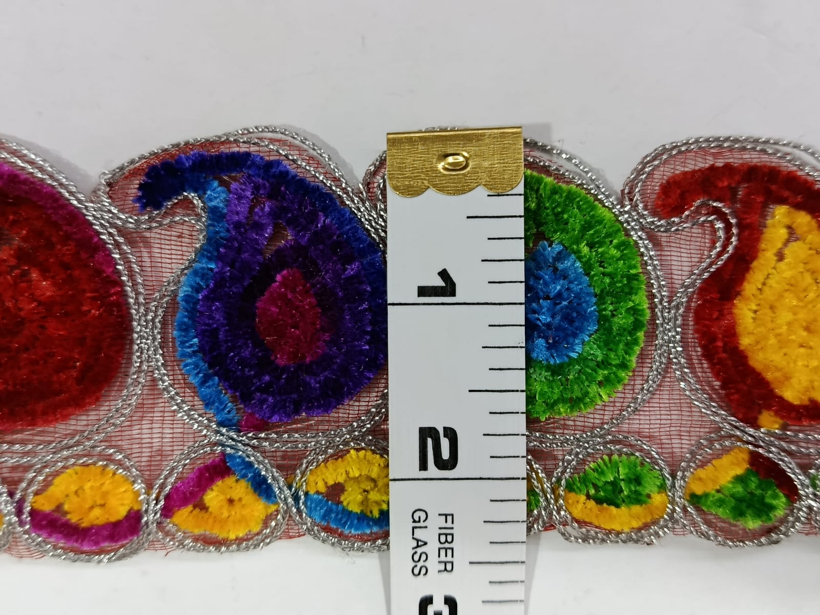 Multicolour Lace with Silver colour Outline. Lae is available as per yard.