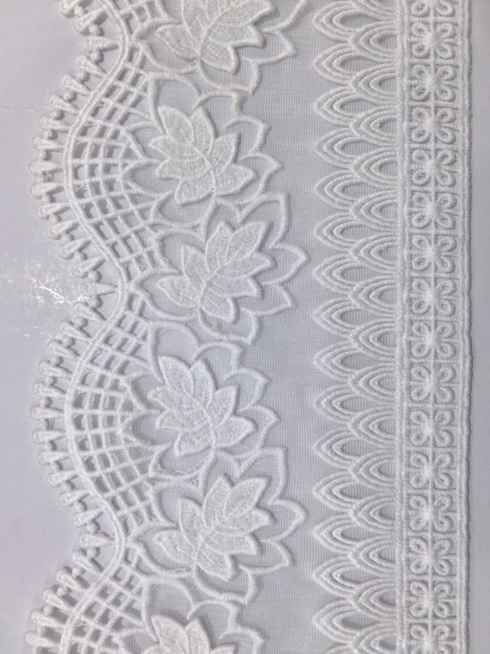 3D Milky White Lace. Lace size is approximately 4.25-4.95 inches. Lace is available as per yard.