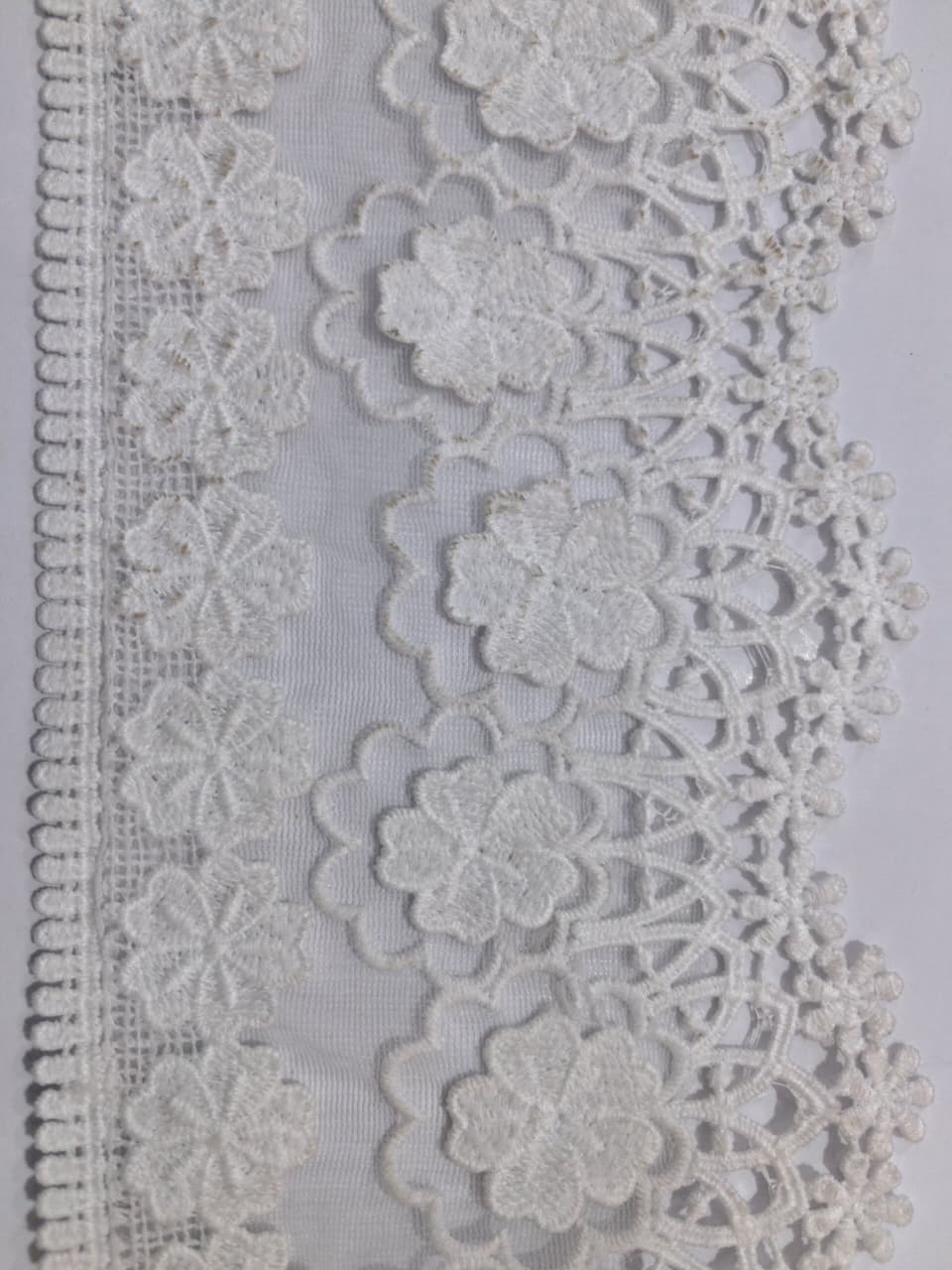 3D Milky White Lace. Lace size is approximately 4.85-5 inches. Lace is available as per yard
